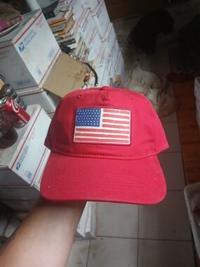 American Crown red cotton baseball cap featuring an American Flag
